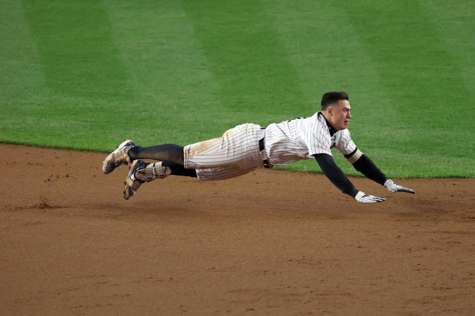 NEW YORK, NEW YORK - OCTOBER 29:  Anthony Volpe #11 of the New York Yankees slides into third during the eighth inning of Game Four of the 2024 World Series against the Los Angeles Dodgers at Yankee Stadium on October 29, 2024 in the Bronx borough of New York City. (Photo by Al Bello/Getty Images)