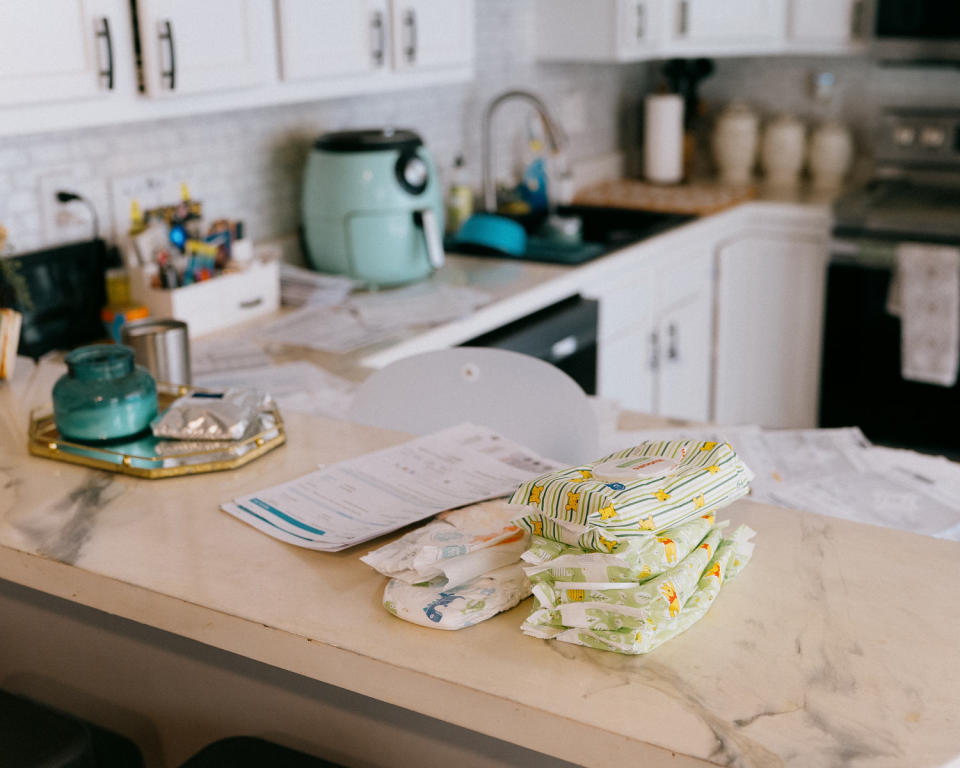 Bills, diapers and wipes lie on the counter at the Hurley home. (Bryan Birks for NBC News)