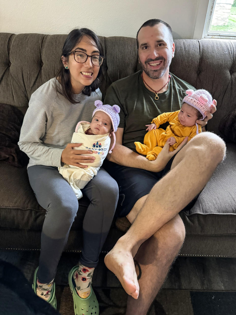 Wesley Bruce and Ashley Perez hold their twins. (Courtesy Ashley Perez)