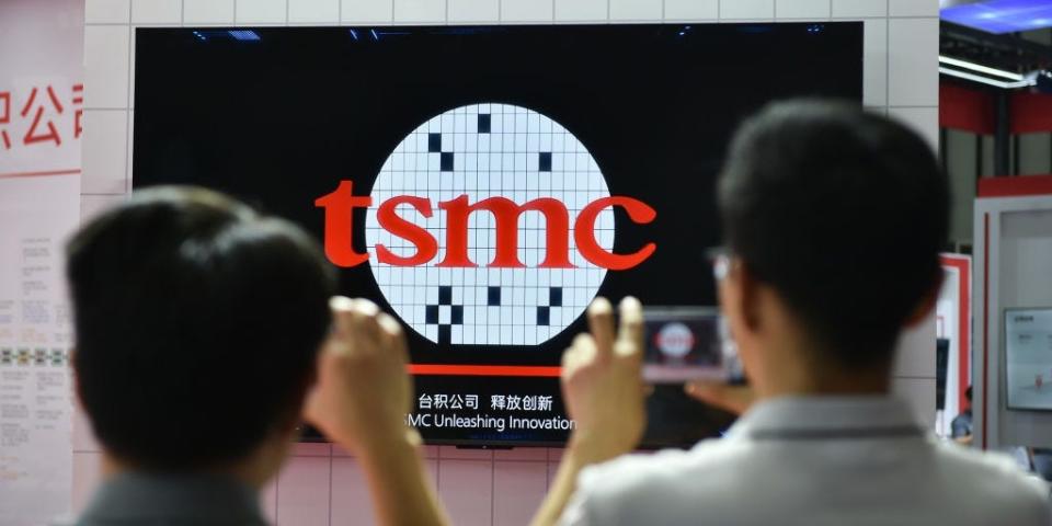 Visitors taking photofs at a TSMC booth at the 2024 World Semiconductor Congress in Nanjing, China.