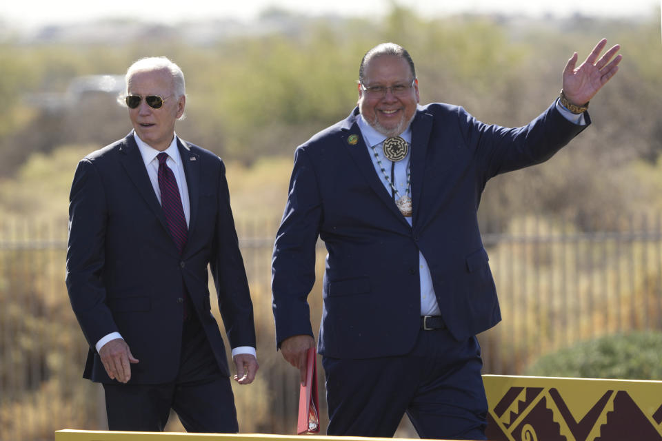 President Joe Biden and Gila River Indian Community Gov. Stephen Roe Lewis speak at the Gila Crossing Community School, Friday, Oct. 25, 2024, in Laveen, Ariz. (AP Photo/Rick Scuteri)