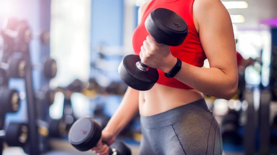 PHOTO: A woman does a bicep curl in an undated stock photo.  (Adobe Stock)