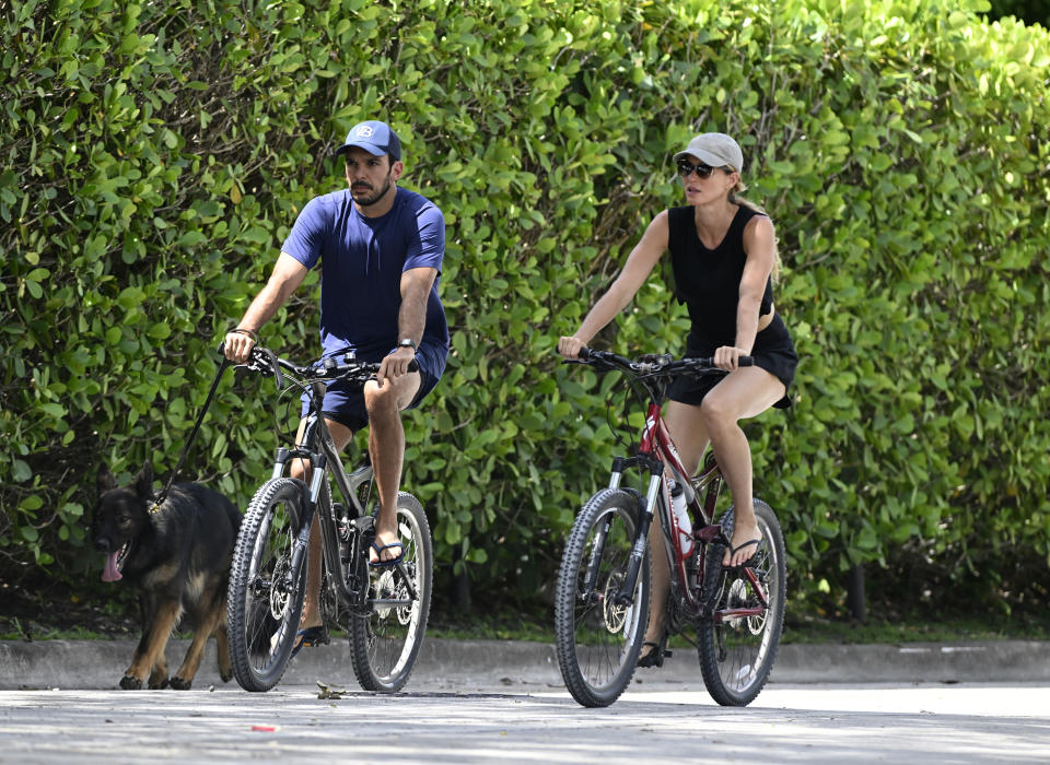 Bündchen and Valente on a bike ride in Surfside, Fla., in July. 