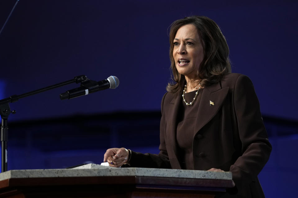 Vice President Kamala Harris at a podium with a single microphone.