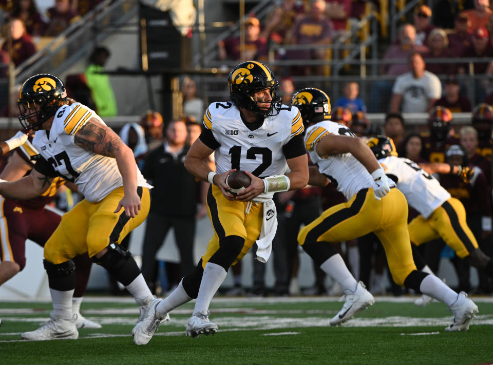 MINNEAPOLIS, MN - SEPTEMBER 21: Iowa Hawkeyes QB Cade McNamara (12) drops back to pass during game between the Iowa Hawkeyes and the Minnesota Golden Gophers on September 21, 2024, at Huntington Bank Stadium in Minneapolis, MN. (Photo by John Rivera/Icon Sportswire via Getty Images)