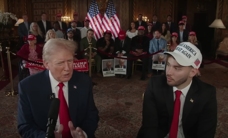 Donald Trump, left, joins 24-year-old internet personality Adin Ross, wearing a white MAGA hat, for an interview 