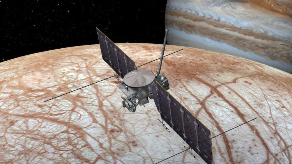  A cube-shaped spacecraft with two solar panels above a white moon streaked with red lines. 