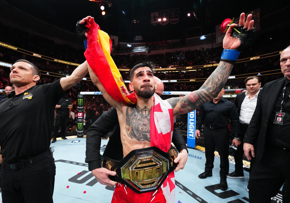 ANAHEIM, CALIFORNIA - FEBRUARY 17: Ilia Topuria of Germany celebrates after his knockout victory against Alexander Volkanovski of Australia in the UFC featherweight championship fight during the UFC 298 event at Honda Center on February 17, 2024 in Anaheim, California. (Photo by Chris Unger/Zuffa LLC via Getty Images)