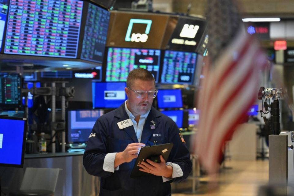 A trader works on the floor of the New York Stock Exchange (NYSE) during morning trading on March 4, 2024 in New York City.