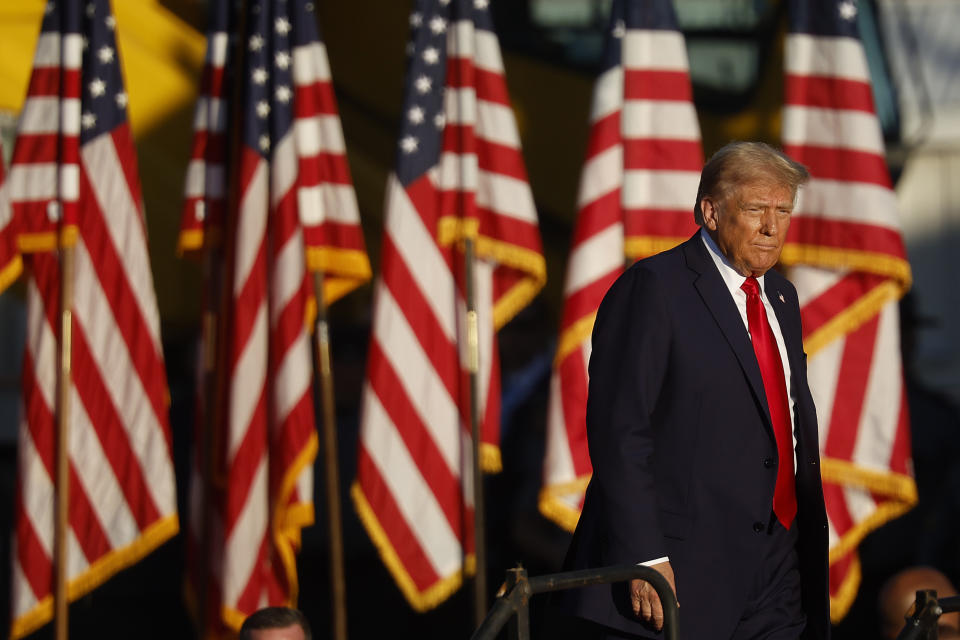 Former President Donald Trump takes the stage during a campaign rally at the Butler Farm Show fairgrounds on Saturday in Butler, Pa.