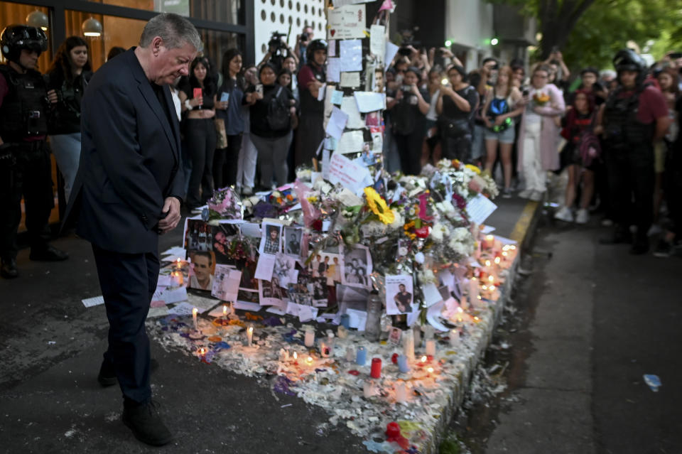 Geoff Payne, left, the father of former One Direction singer Liam Payne, visits a memorial outside the CasaSur Palermo Hotel where the British pop singer fell to his death from a hotel balcony, in Buenos Aires, Argentina, on Oct. 18.