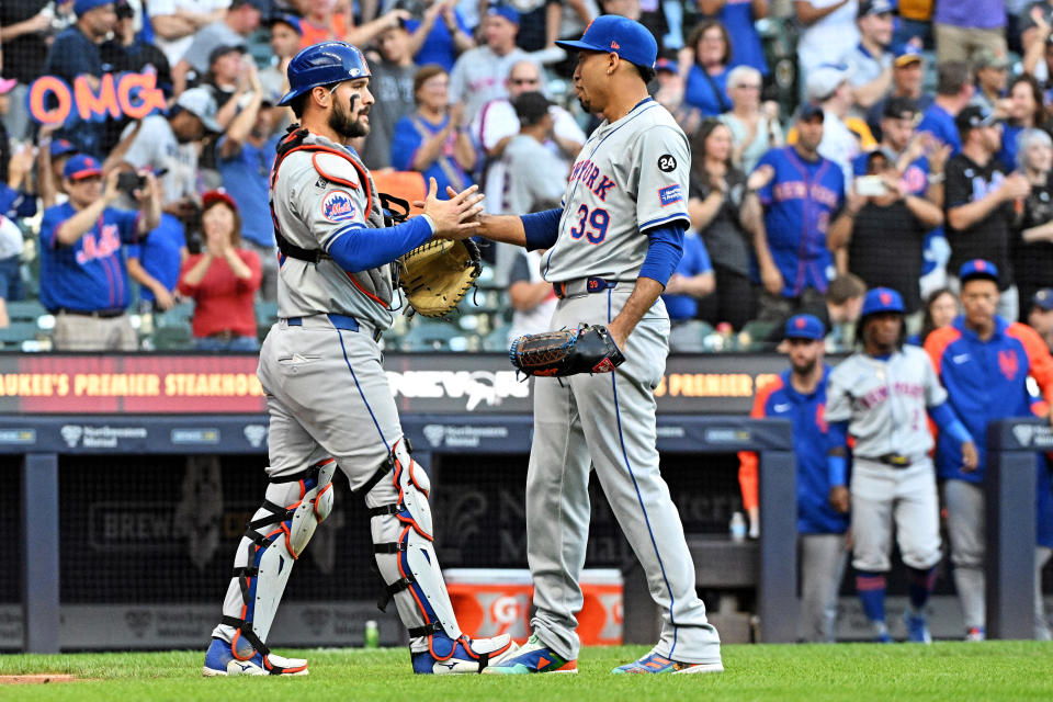 Sep 29, 2024; Milwaukee, Wisconsin, USA; New York Mets outfielder Harrison Bader (44) and New York Mets pitcher Edwin Díaz (39) celebrate a 5-0 win over the Milwaukee Brewers at American Family Field. Mandatory Credit: Michael McLoone-Imagn Images