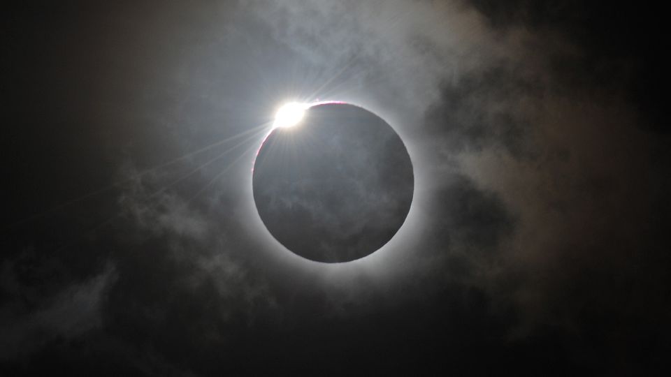 The "diamond ring" effect is visible as the moon makes its final move over the sun during a total solar eclipse at Palm Cove, Australia, in November 2012. - Greg Wood/AFP/Getty Images