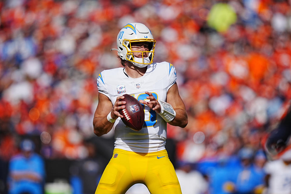 Oct 13, 2024; Denver, Colorado, USA; Los Angeles Chargers quarterback Justin Herbert (10) prepares to pass the ball during the second quarter against the Denver Broncos at Empower Field at Mile High. Mandatory Credit: Ron Chenoy-Imagn Images