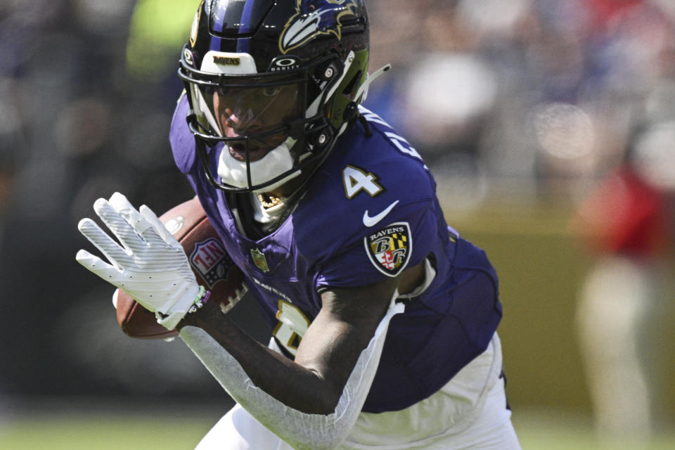 Oct 13, 2024; Baltimore, Maryland, USA;  Baltimore Ravens wide receiver Zay Flowers (4) runs after a catch during the first half against the Washington Commanders at M&T Bank Stadium. Mandatory Credit: Tommy Gilligan-Imagn Images