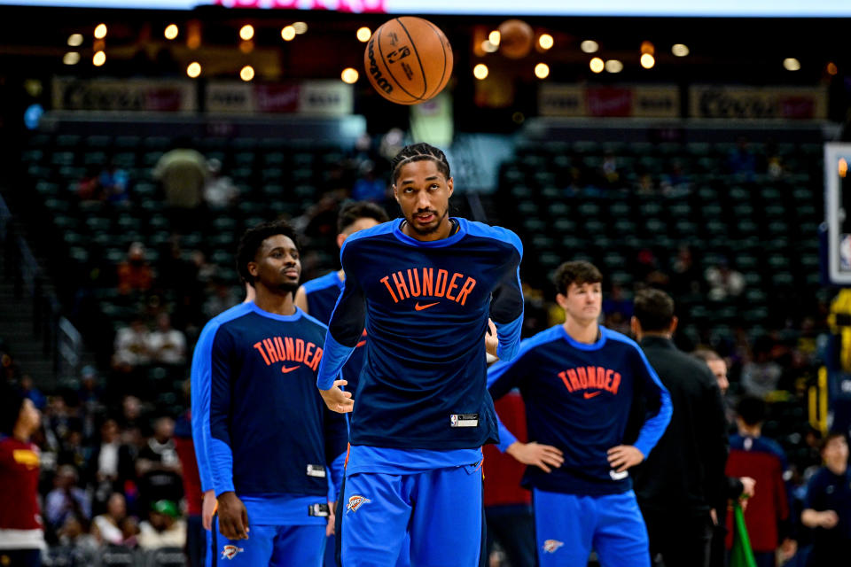 DENVER, COLORADO - OCTOBER 25: Shai Gilgeous-Alexander #2 of the Oklahoma City Thunder bounces the ball as players warm up before a game against the Denver Nuggets at Ball Arena on October 15, 2024 in Denver, Colorado. NOTE TO USER: User expressly acknowledges and agrees that, by downloading and or using this photograph, User is consenting to the terms and conditions of the Getty Images License Agreement. (Photo by Dustin Bradford/Getty Images)