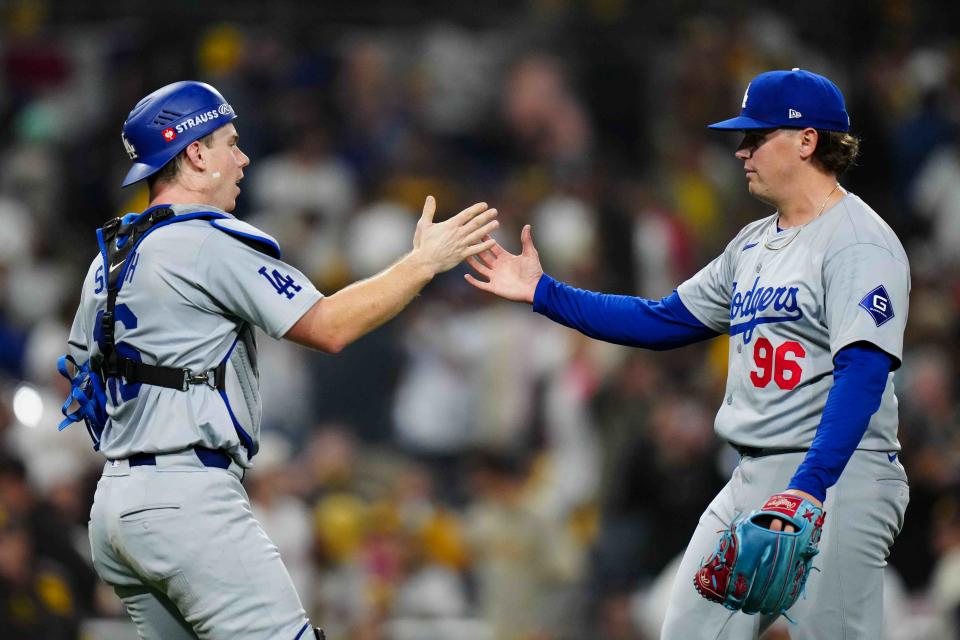 SAN DIEGO, CA - OCTOBER 09:   Will Smith #16 and Landon Knack #96 of the Los Angeles Dodgers celebrate after winning Game 4 of the Division Series presented by Booking.com between the Los Angeles Dodgers and the San Diego Padres at Petco Park on Wednesday, October 9, 2024 in San Diego, California. (Photo by Daniel Shirey/MLB Photos via Getty Images)