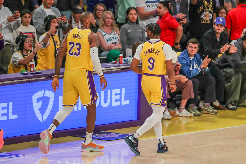 LOS ANGELES, CA - OCTOBER 22: Los Angeles Lakers forward LeBron James (23) and son Los Angeles Lakers guard Bronny James (9) enter the game during the Minnesota Timberwolves vs Los Angeles Lakers game on October 22, 2024, at Crypto.com Arena in Los Angeles, CA. (Photo by Jevone Moore/Icon Sportswire via Getty Images)