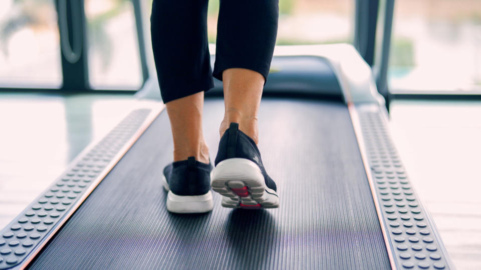 feet walking on a treadmill