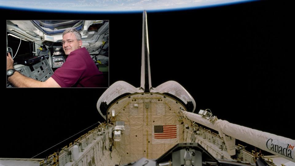  Image of the space shuttle and canadarm above earth with an inset image of an astronaut at the controls of the shuttle. 