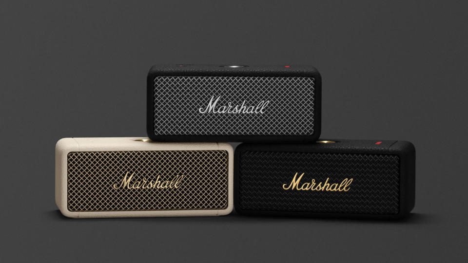 Three Marshall Emberton II Bluetooth speakers stacked on each other in a pyramid. Dark gray background.