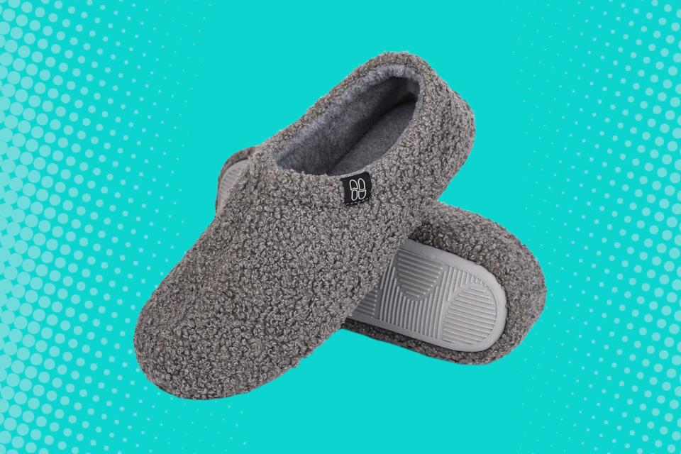 A pair of gray fuzzy slippers.