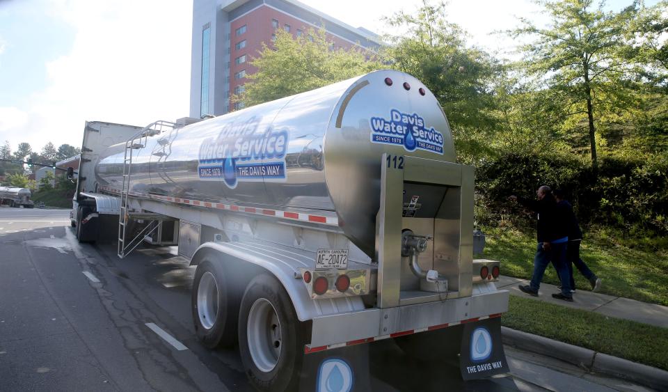 Oct 2, 2024; ASHEVILLE, NC; A water tanker sits outside Mission Hospital in the aftermath of Hurricane Helene. Helene’s swath of destruction brought historic rainfall, flooding, power outages and 140-mile-an-hour winds across the Southeast. North Carolina that bore the brunt of damage, with vast swaths of cities like Asheville underwater, residents trapped in their homes with no lights or food and few functioning roads for rescue workers to help them.. Mandatory Credit: Thomas Costello Ii-USA TODAY