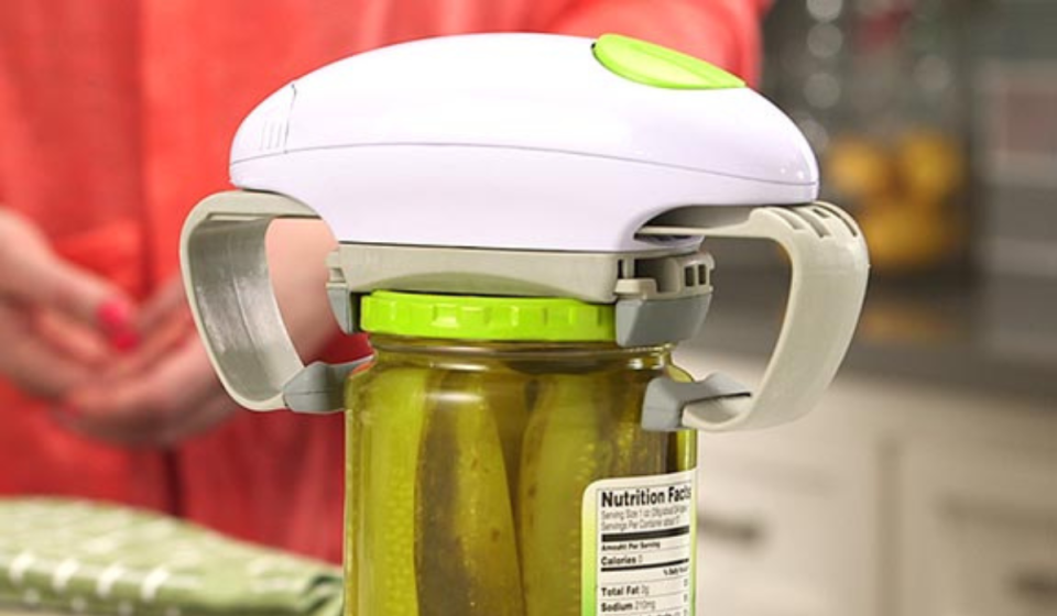 the robo twist jar opener on top of a jar of pickles