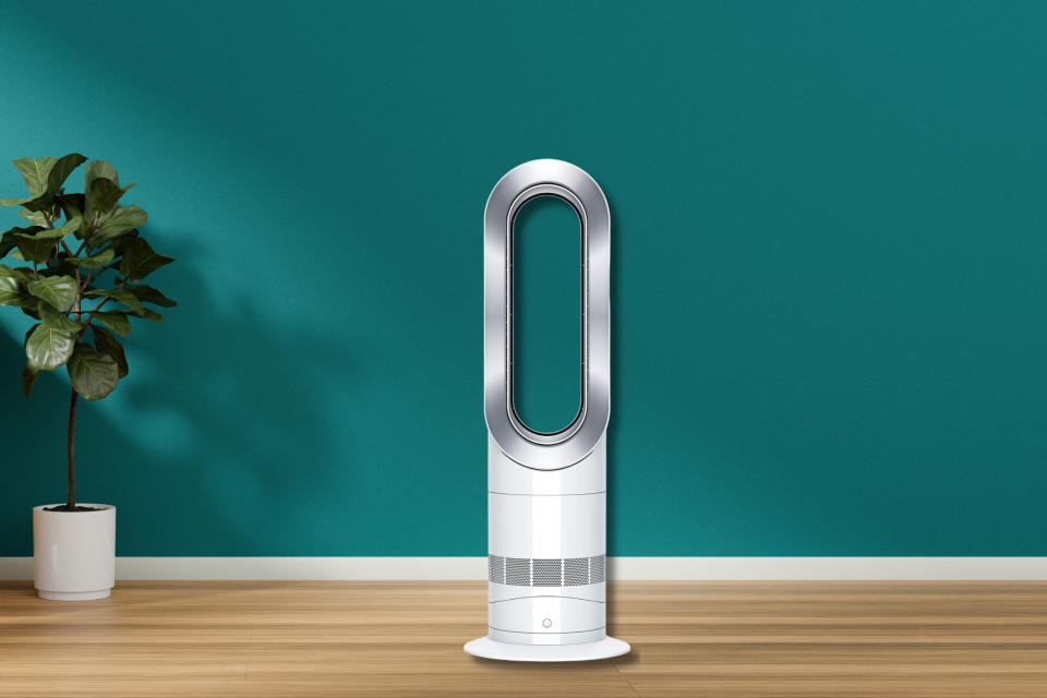 The Dyson space heater against a green wall