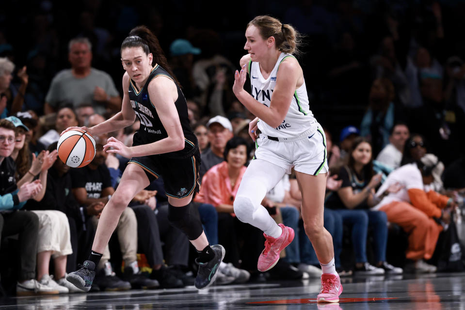 NEW YORK, NEW YORK - OCTOBER 13: Breanna Stewart #30 of the New York Liberty drives past Alanna Smith #8 of the Minnesota Lynx during the third quarter of Game Two of the WNBA Finals at Barclays Center on October 13, 2024 in New York City.  (Photo by Dustin Satloff/Getty Images)