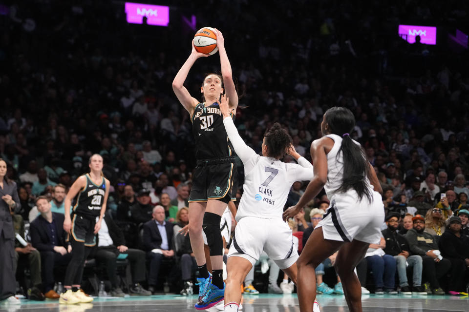 Sep 29, 2024; Brooklyn, New York, USA; New York Liberty forward Breanna Stewart (30) shoots a jump shot over Las Vegas Aces forward Alysha Clark (7) during game one of the 2024 WNBA Semi-finals at Barclays Center. Mandatory Credit: Gregory Fisher-Imagn Images