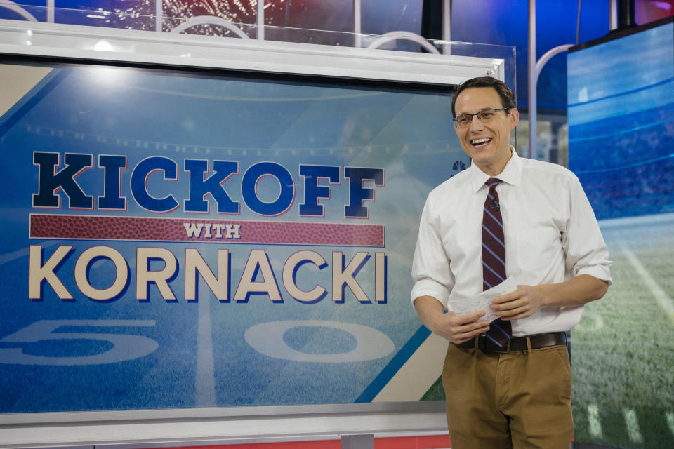 Steve Kornacki laughs in front of a screen displaying the words Kickoff With Kornacki.