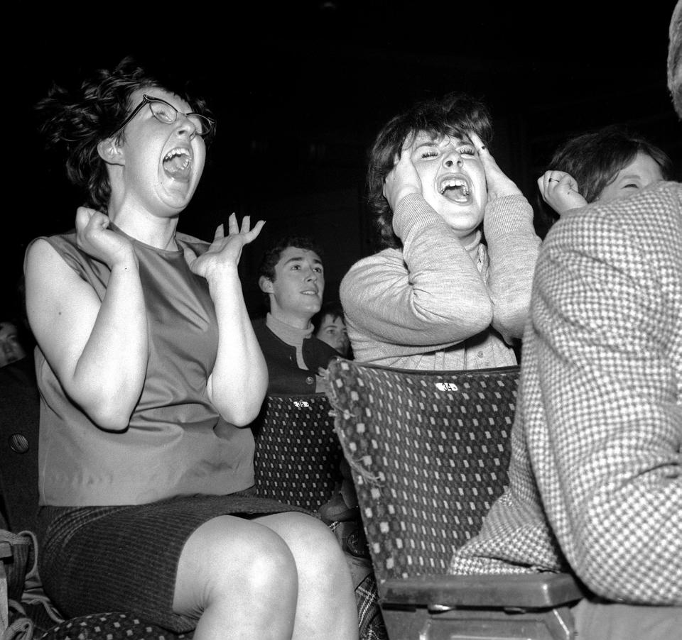 Screaming schoolgirl fans greet the Beatles in Exeter in 1963.