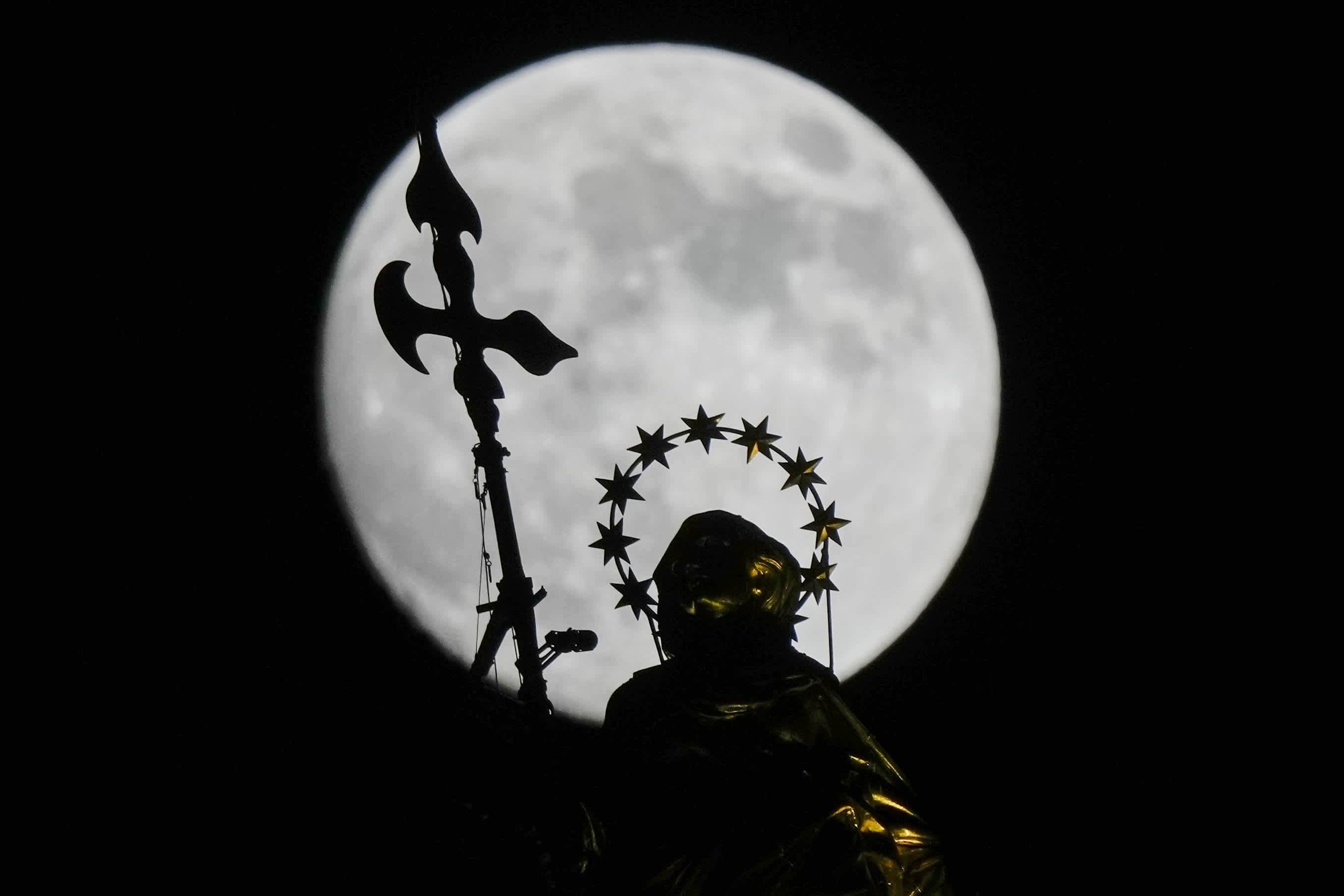 The supermoon is seen above a park in Lianyungang city, China, on Friday.