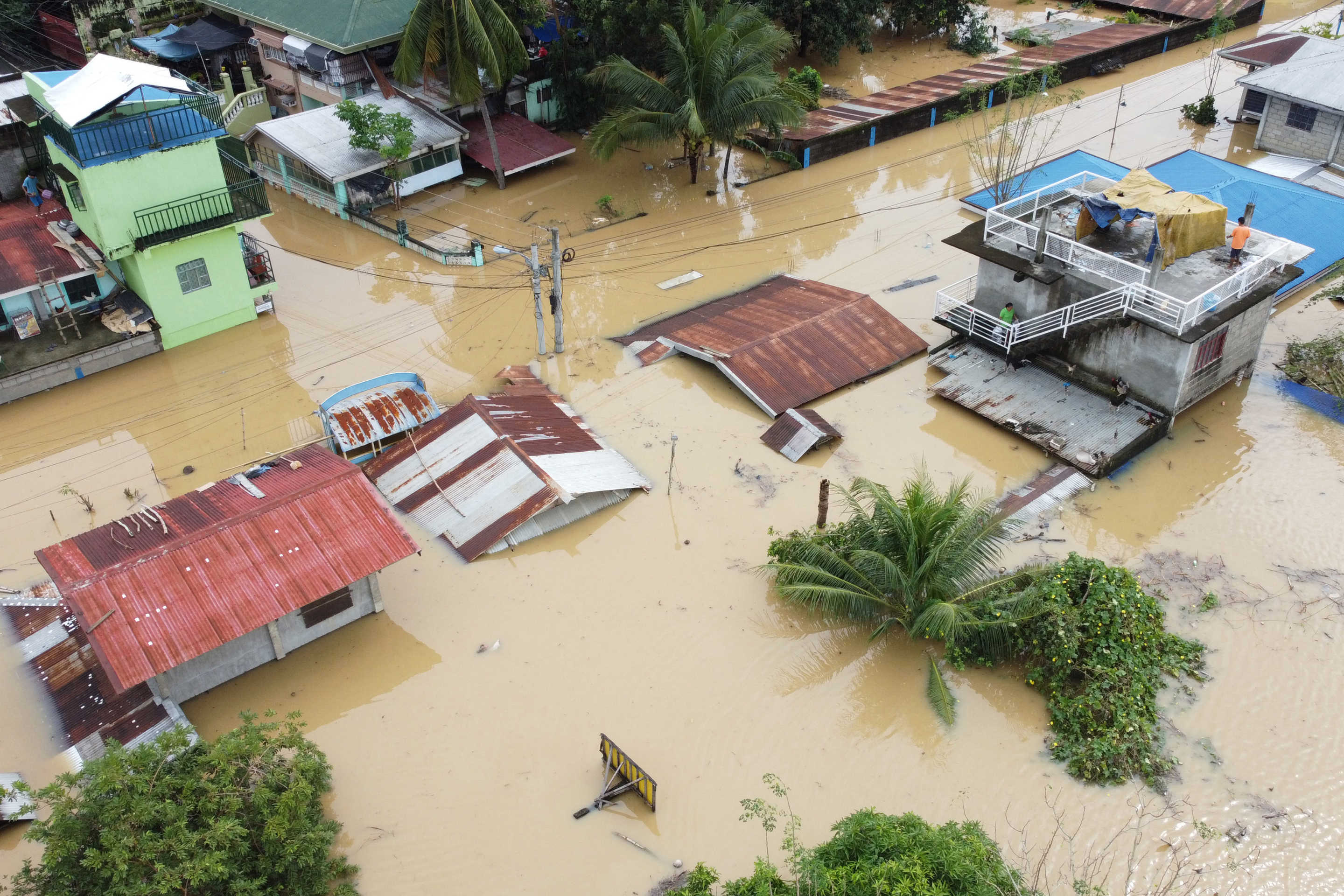 An aerial view shows submerged homes at a village in Ilagan, Isabela province due to continuous heavy rains from Super Typhoon Man-yi.