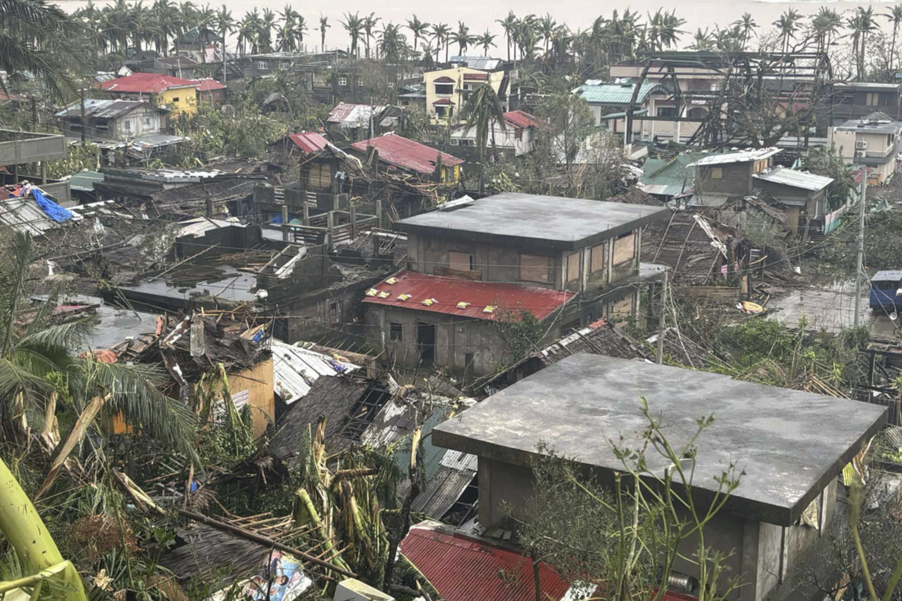 Damaged houses caused by Typhoon Man-yi in Viga, Catanduanes province, northeastern Philippines Sunday, Nov. 17.