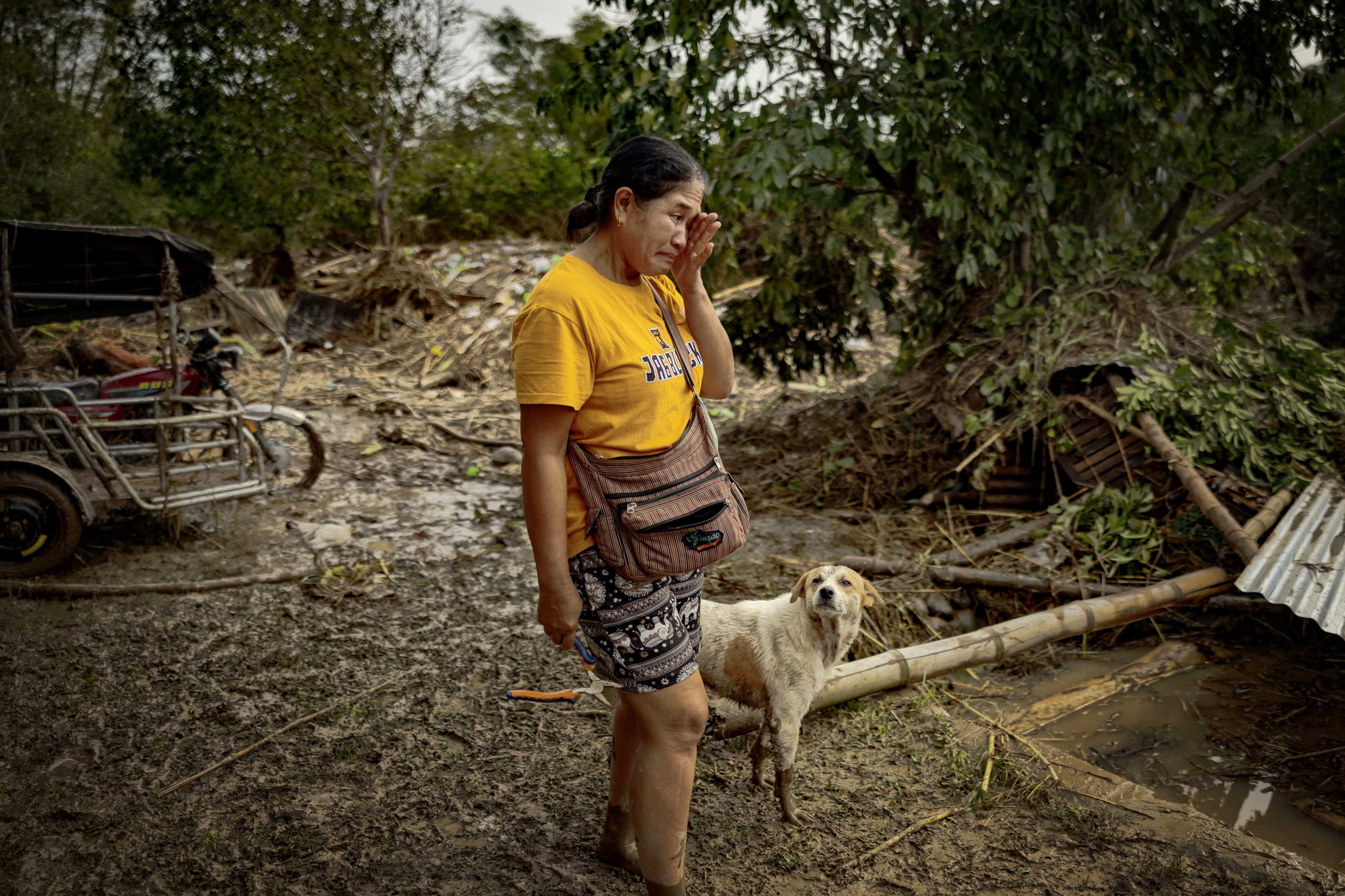 A resident cries as she inspects her house that was flooded by Super Typhoon Man-yi in Bayombong, Nueva Vizcaya province.