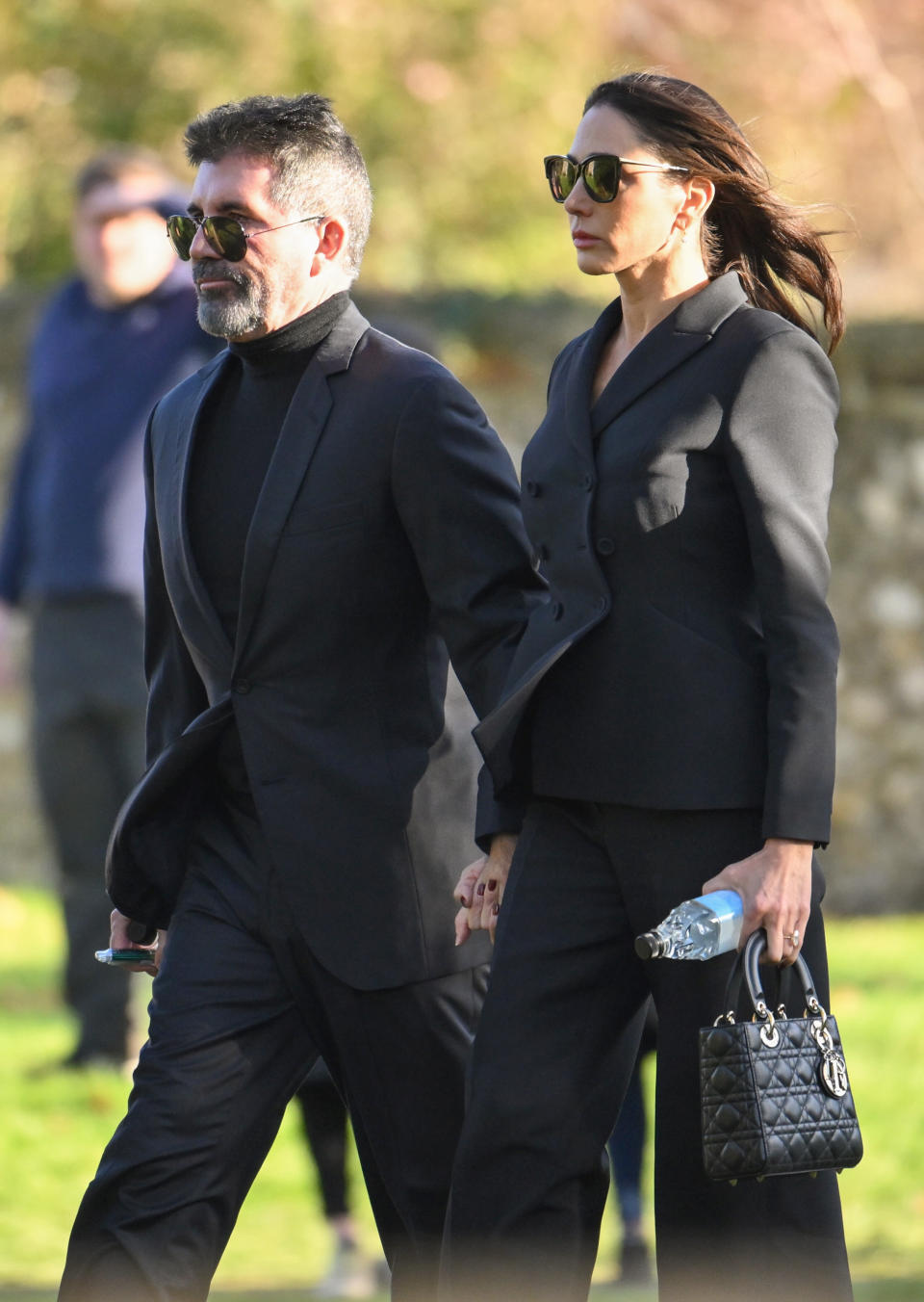 Simon Cowell and Lauren Silverman attend the funeral for singer Liam Payne on Thursday.