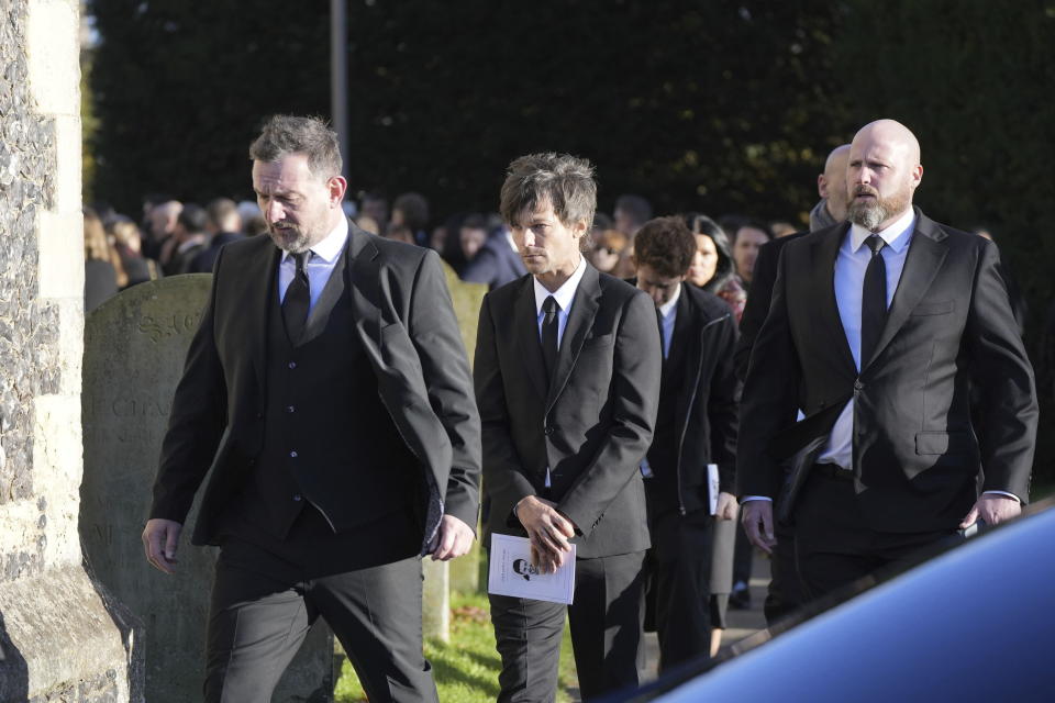 Louis Tomlinson, centre, walks after the funeral service of One Direction singer Liam Payne on Thursday.