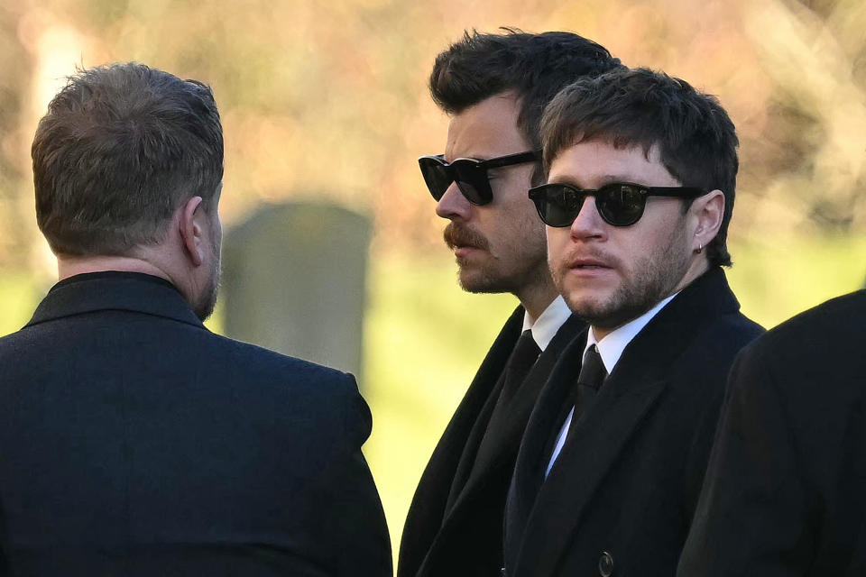 Former One Direction band members Harry Styles and Niall Horan leave after attending the funeral service of the late One Direction singer Liam Payne on Thursday.