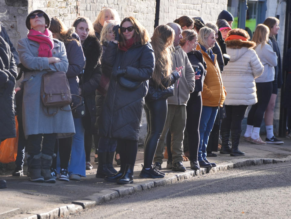 Members of the public line the route to the funeral service of One Direction singer Liam Payne on Thursday.