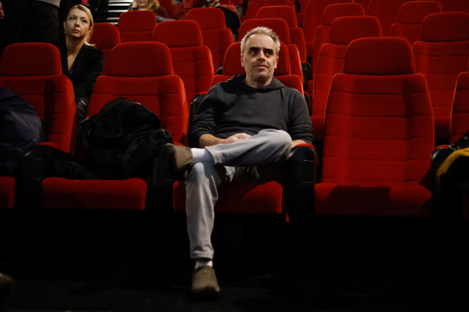 Souza in the theater waiting for the screening to begin. (Kuba Stezycki/Reuters)