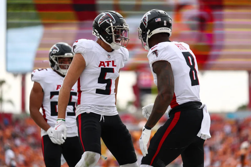 Oct 27, 2024; Tampa, Florida, USA; Atlanta Falcons wide receiver Drake London (5) congratulates tight end Kyle Pitts (8) after scoring a touchdown against the Tampa Bay Buccaneers in the second quarter at Raymond James Stadium. Mandatory Credit: Nathan Ray Seebeck-Imagn Images