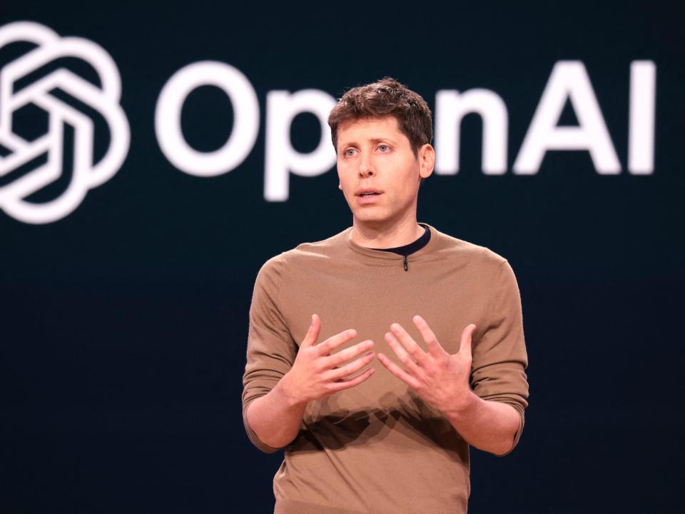 Sam Altman presenting on stage