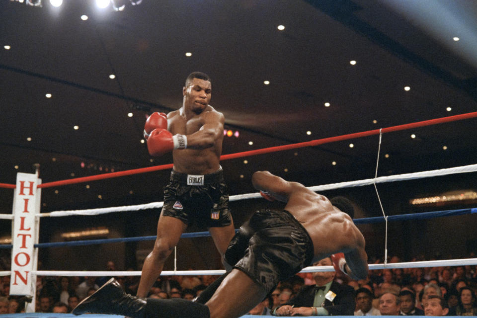 Mike Tyson knocks down Trevor Berbick in 1986. 