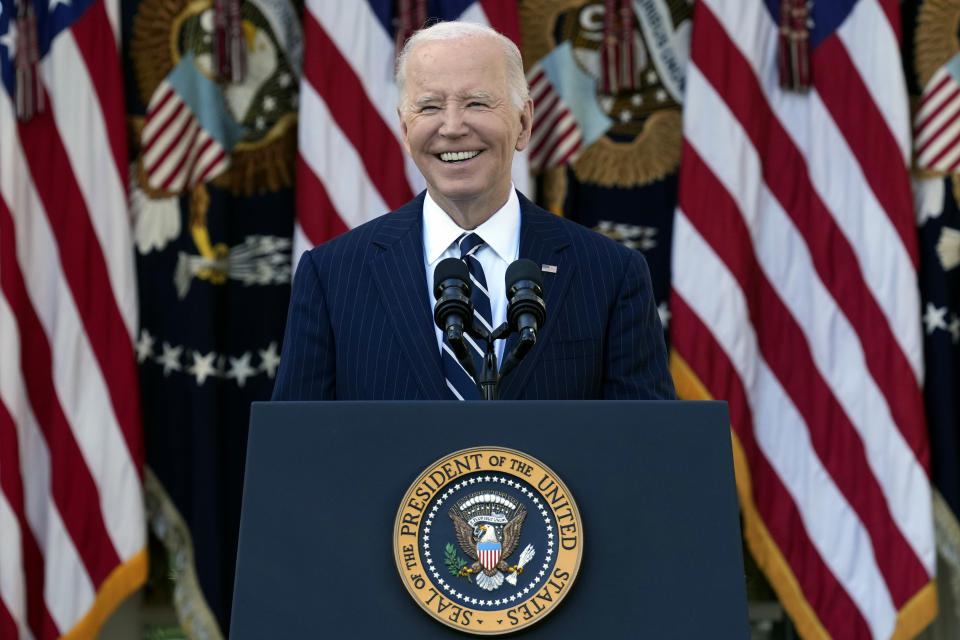 President Biden speaks at the presidential podium in the Rose Garden of the White House.