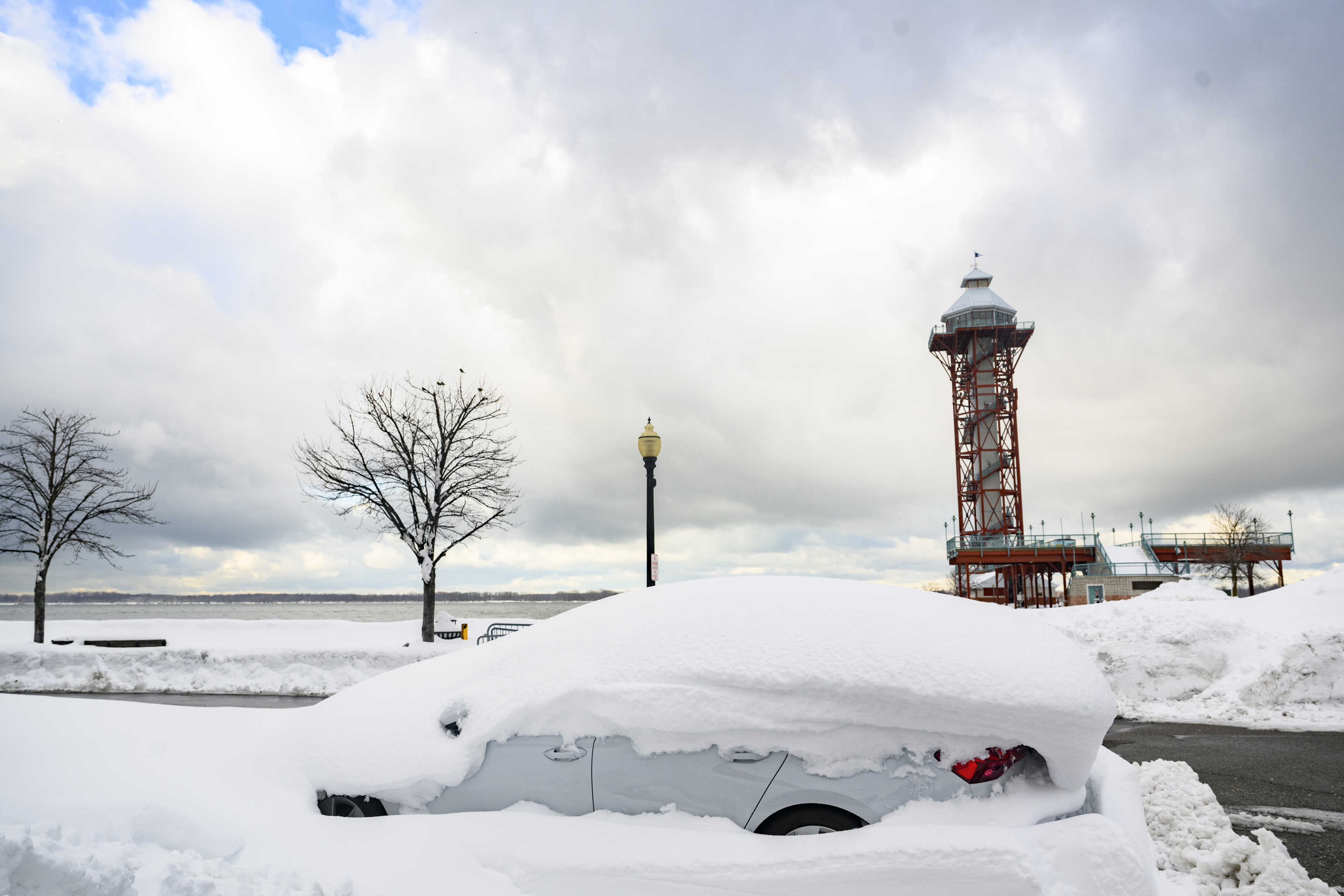 A buried vehicle along the shore of Lake Erie.