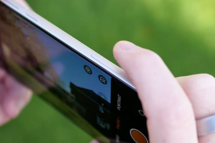 A person using the Oppo Find X8 Pro's Quick Button.