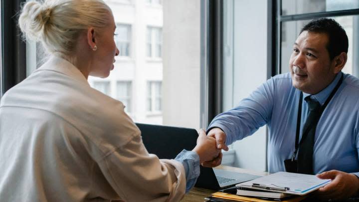 two people shaking hands