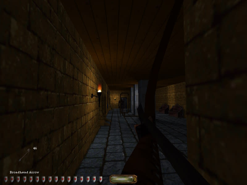 A first person view in Thief with the character aiming a bow down a corridor